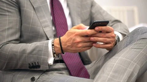 Handsome young business man using smartphone smiling happy wearing suit jacket Stock Footage 94838085