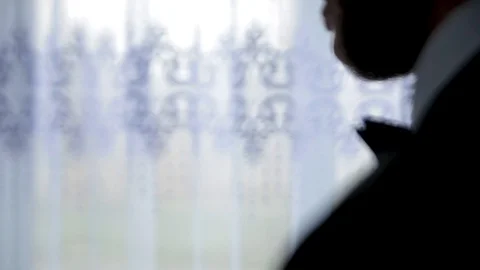 Handsome young businessman using perfume Stock Footage 89932104