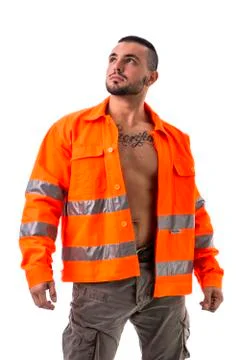 Handsome young construction worker with orange suit Stock Photos