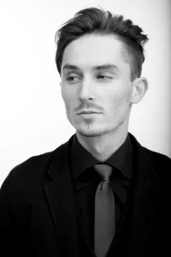 Handsome young elegant man studio portrait close-up. Stock Photos