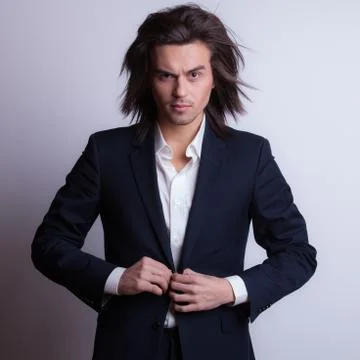 Handsome young elegant man studio portrait close-up. Stock Photos