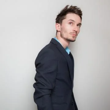 Handsome young elegant man studio portrait close-up. Stock Photos