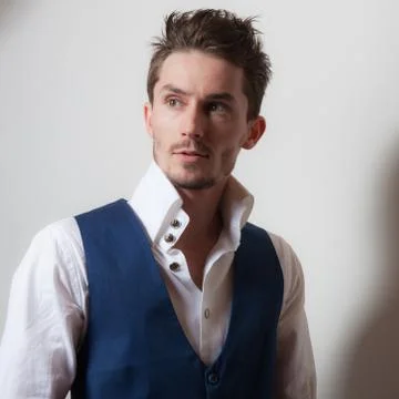 Handsome young elegant man studio portrait close-up. Stock Photos