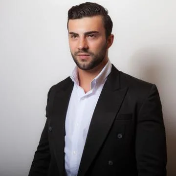 Handsome young elegant man studio portrait close-up. 写真素材