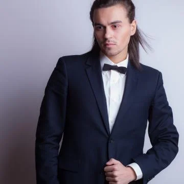 Handsome young elegant man studio portrait close-up. Stock Photos