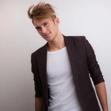 Handsome young elegant man studio portrait close-up. Stock Photos