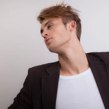 Handsome young elegant man studio portrait close-up. Stock Photos