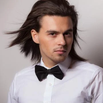 Handsome young elegant man studio portrait close-up. Stock Photos