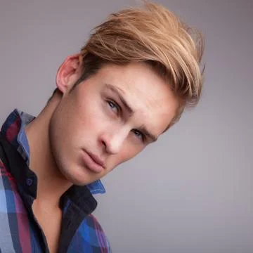 Handsome young elegant man studio portrait close-up. Stock Photos