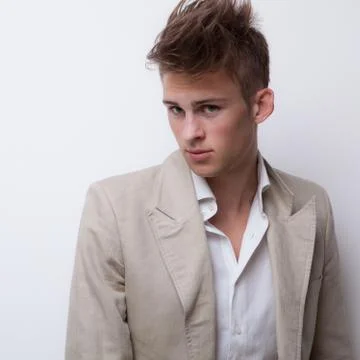 Handsome young elegant man studio portrait close-up. Stock Photos