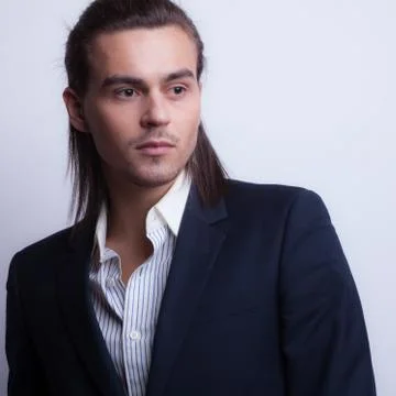 Handsome young elegant man studio portrait close-up. Stock Photos
