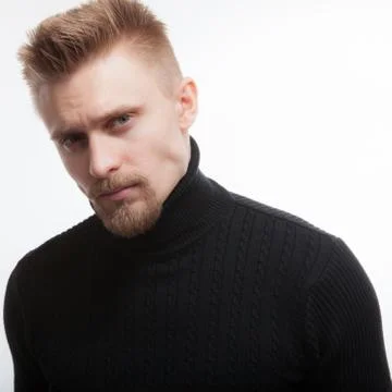 Handsome young elegant man studio portrait close-up. Stock Photos