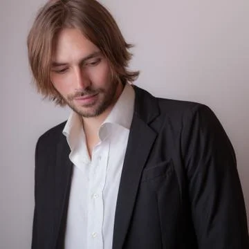 Handsome young elegant man studio portrait close-up. Stock Photos