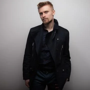 Handsome young elegant man studio portrait close-up. Stock Photos