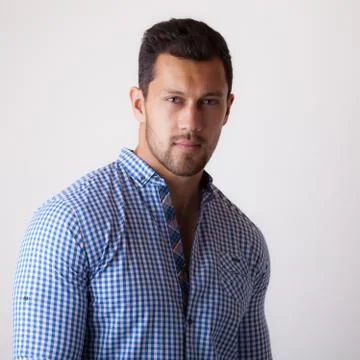 Handsome young elegant man studio portrait close-up. Stock Photos