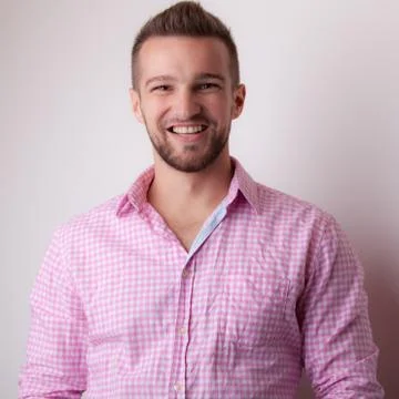 Handsome young elegant man studio portrait close-up. Stock Photos