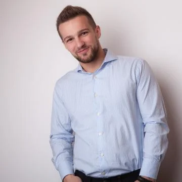 Handsome young elegant man studio portrait close-up. Stock Photos