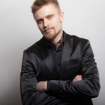Handsome young elegant man studio portrait close-up. Stock Photos