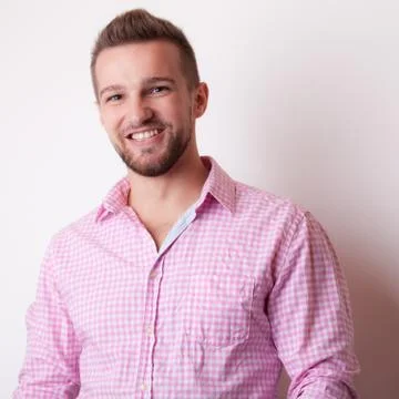 Handsome young elegant man studio portrait close-up. Stock Photos