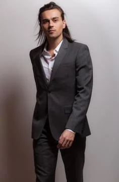 Handsome young elegant man studio portrait close-up. Stock Photos