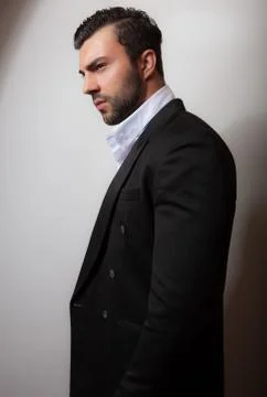 Handsome young elegant man studio portrait close-up. Stock Photos