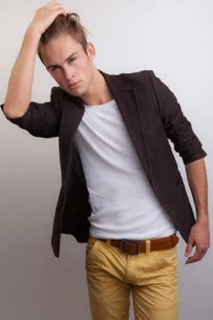 Handsome young elegant man studio portrait close-up. Stock Photos