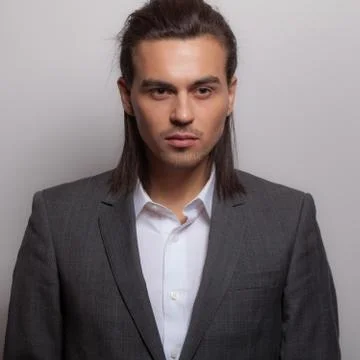 Handsome young elegant man studio portrait close-up. Stock Photos
