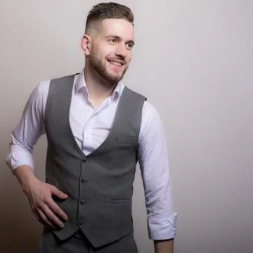 Handsome young elegant man studio portrait close-up. Stock Photos