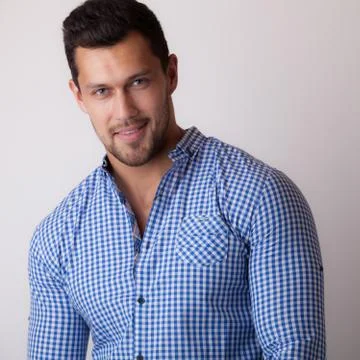 Handsome young elegant man studio portrait close-up. Stock Photos