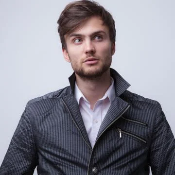 Handsome young elegant man studio portrait close-up. Stock Photos