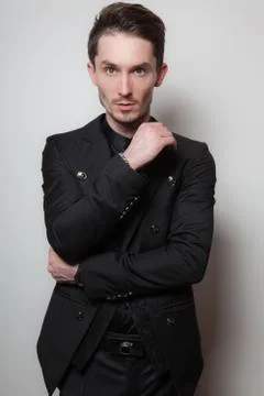 Handsome young elegant man studio portrait close-up. Stock Photos