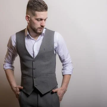 Handsome young elegant man studio portrait close-up. Stock Photos
