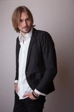 Handsome young elegant man studio portrait close-up. Stock Photos