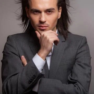 Handsome young elegant man studio portrait close-up. Stock Photos