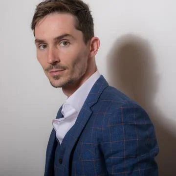 Handsome young elegant man studio portrait close-up. Stock Photos