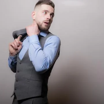 Handsome young elegant man studio portrait close-up. Stock Photos