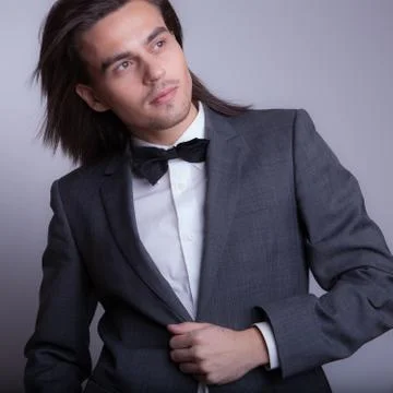 Handsome young elegant man studio portrait close-up. Stock Photos