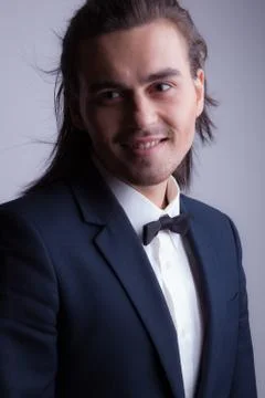 Handsome young elegant man studio portrait close-up. Stock Photos