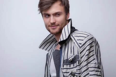 Handsome young elegant man studio portrait close-up. Stock Photos