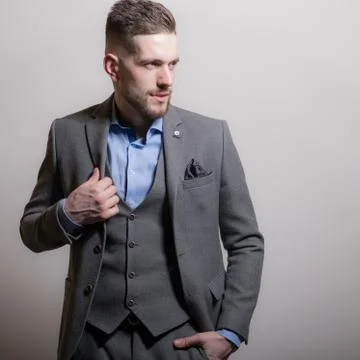 Handsome young elegant man studio portrait close-up. Stock Photos
