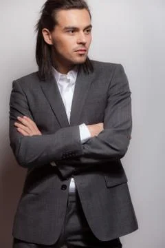 Handsome young elegant man studio portrait close-up. Stock Photos