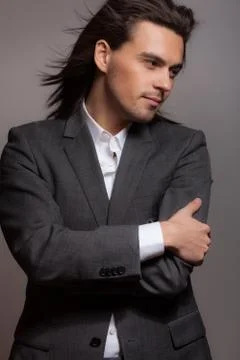 Handsome young elegant man studio portrait close-up. Stock Photos