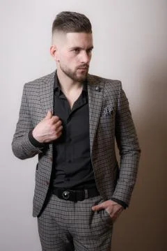Handsome young elegant man studio portrait close-up. Stock Photos