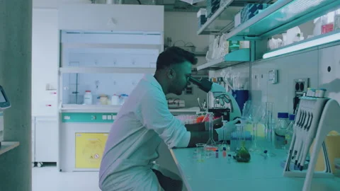 Handsome Young Ethnic Lab Scientist Looking Straight at the Camera Stock Footage 164992009