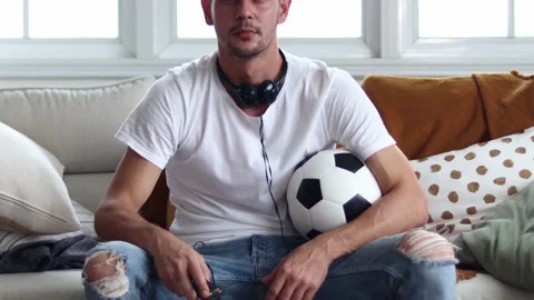 Handsome young excited  while watching football. Stock Footage 163088253