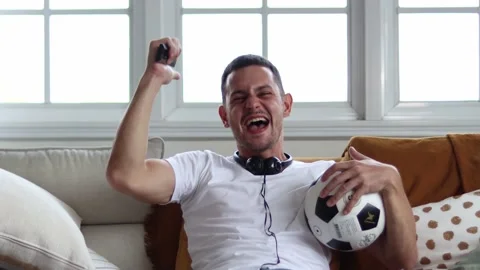 Handsome young excited  while watching football. Stock Footage 163088304
