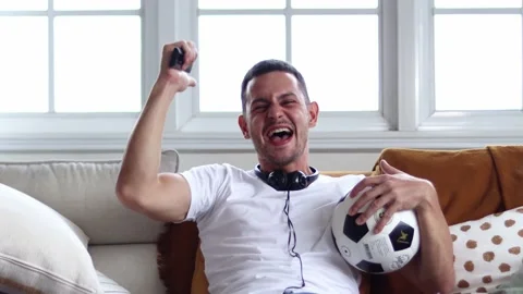 Handsome young excited  while watching football. Stock Footage 163088340