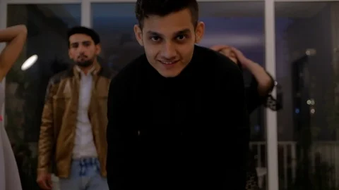 Handsome young guy in black makes his hair and starts to sway and move to hip-hi Stock Footage 101333621