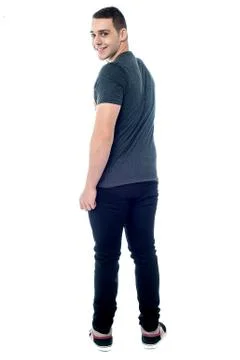 Handsome young guy looking back Stock Photos