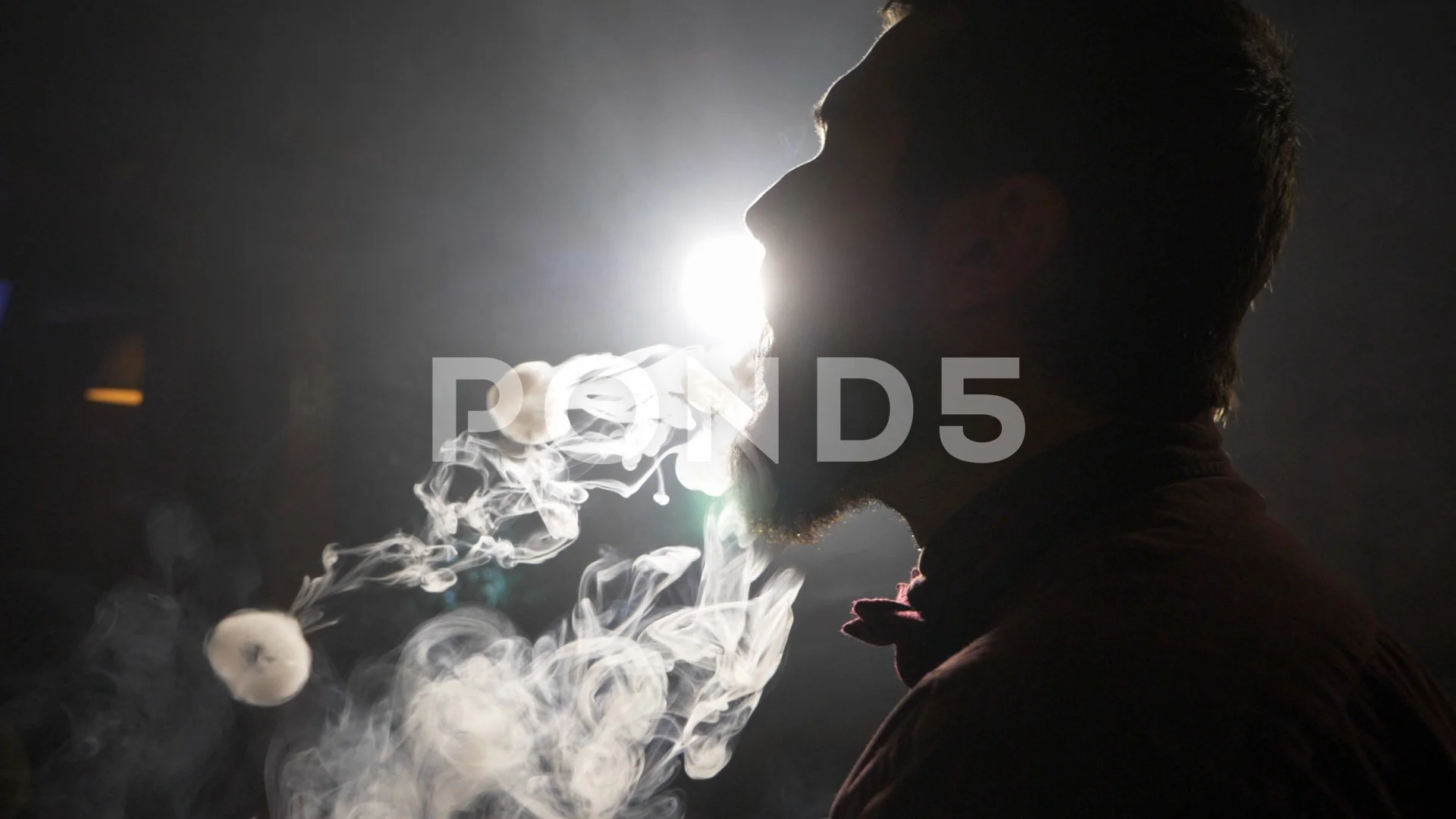 Handsome young guy smoking hookah and ma... | Stock Video | Pond5